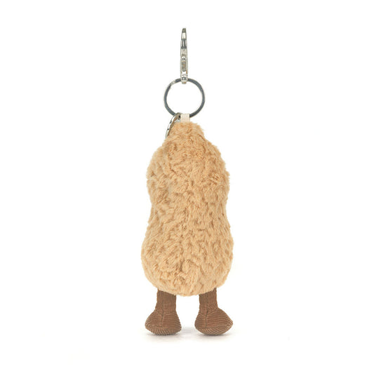 Back view of Jellycat Amuseables Peanut Bag Charm Plush keychain in the shape of a peanut with a smiling face on a white background