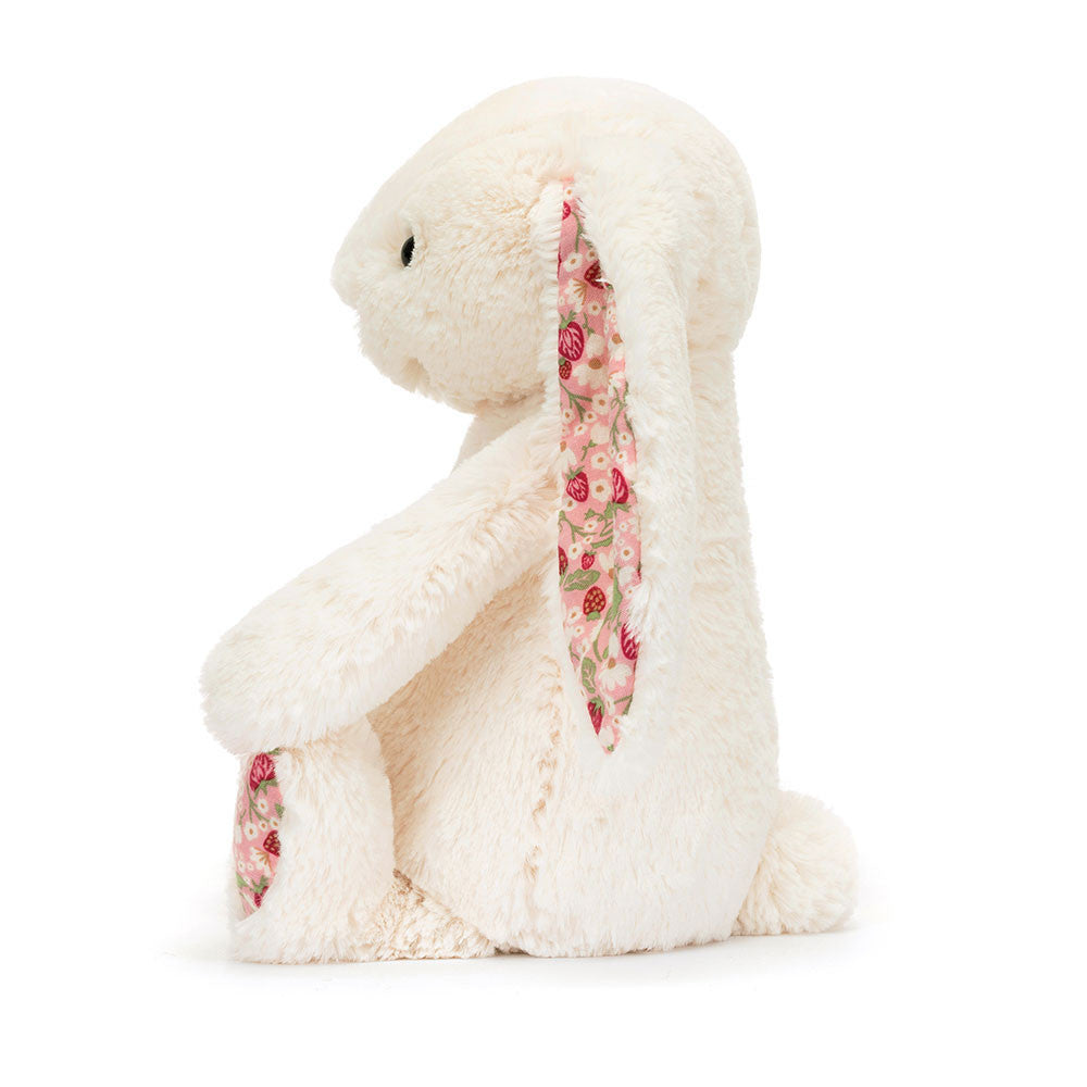 Side view of Jellycat Plush Blossom Cream Bunny Berry Little White plush bunny with floral ears on a white background