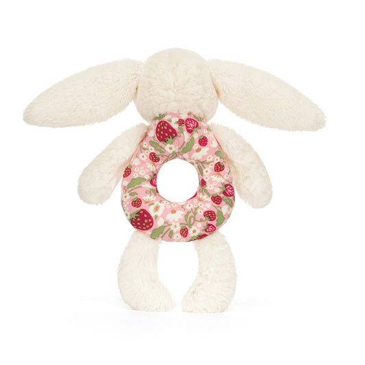 Jellycat Plush Blossom Cream Bunny Berry Ring Rattle White plush bunny toy with a floral ring on a white background
