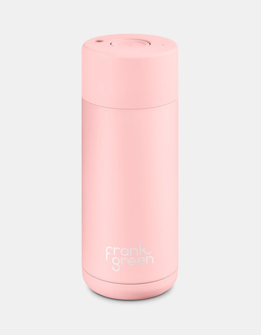Pink reusable water bottle with 'frank green' branding on a light gray background