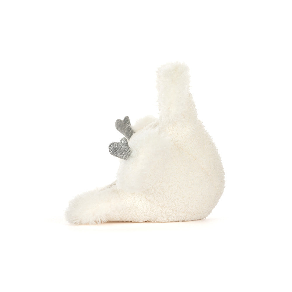 Side view of Jellycat Amuseables Snowflake showing fluffy plush texture and silvery thread detailing.
