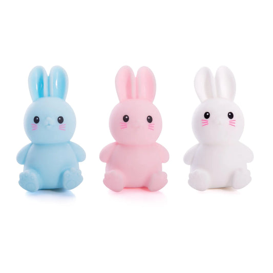 Three colorful Squishy Bunnies from Discovery Zone on a white background