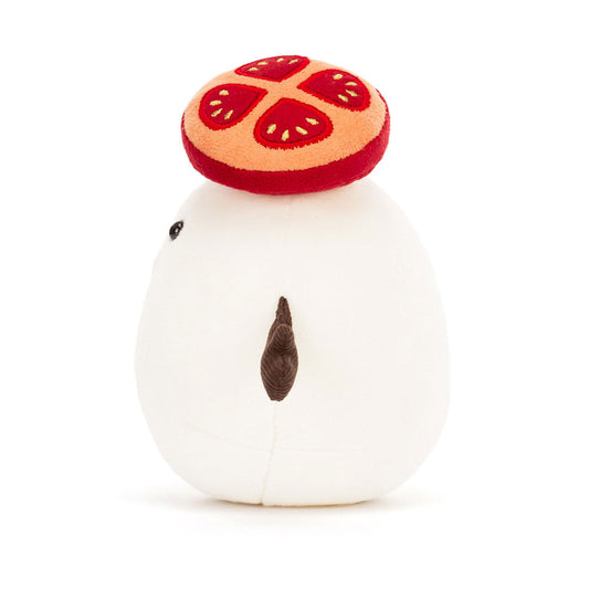 Side view of Jellycat Amuseables Mozzarella Plush toy resembling a block of cheese with a red hat, brown arms on a white background