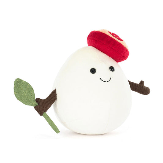 Jellycat Amuseables Mozzarella Plush toy resembling a block of cheese with a red hat, green leaf, and brown arms on a white background