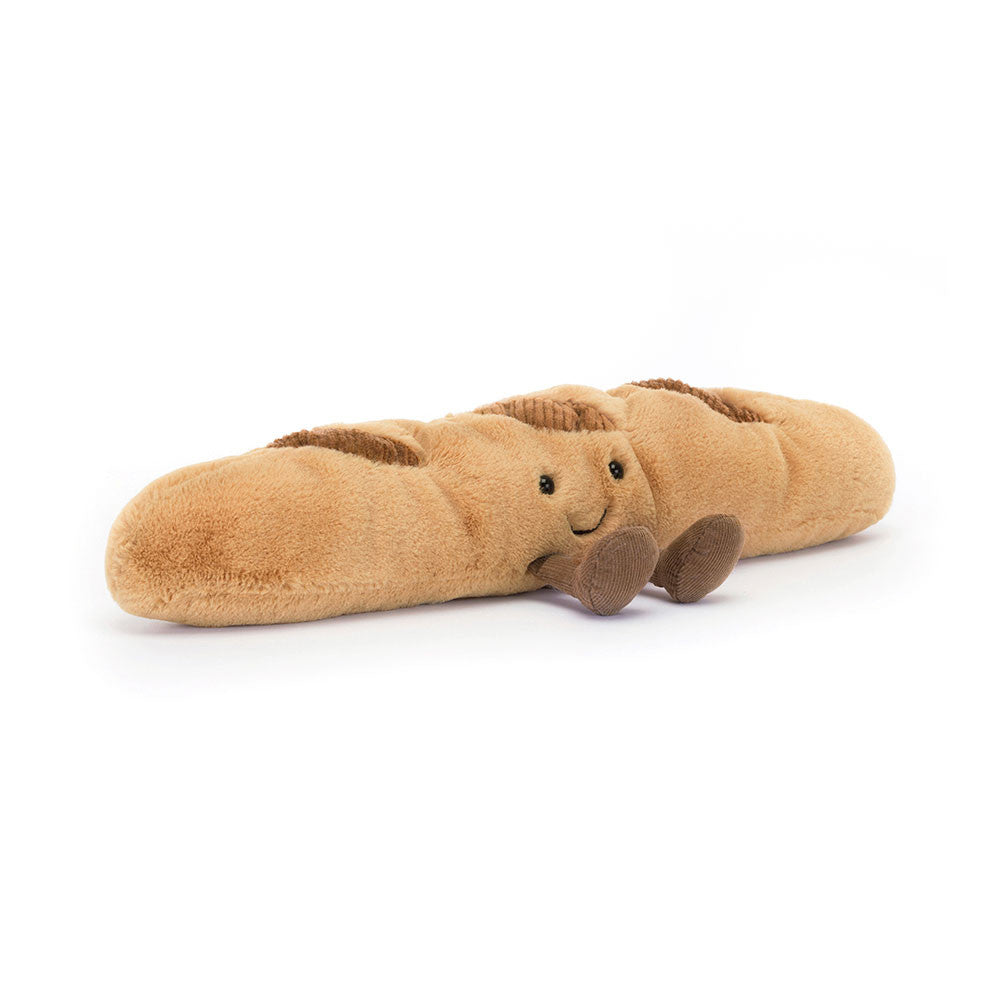 Jellycat Plush Amuseables Baguette Plush toy shaped like a baguette with a face on a white background