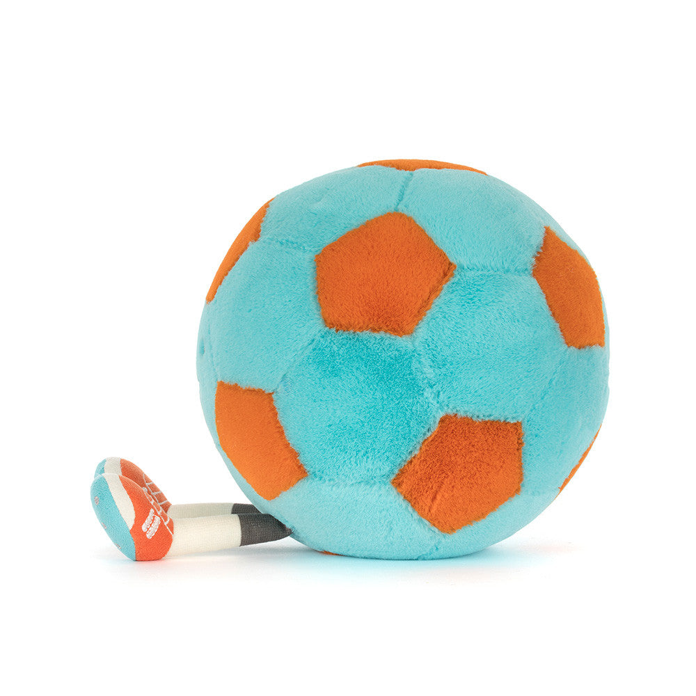 Side view of Jellycat Plush Amuseables Football on a white background plush toy resembling a soccer ball with orange and blue patterns on a white background