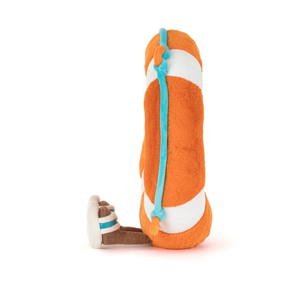 Side view of Jellycat Plush Amuseables Life Ring with brown legs , feet in sandals on a white background