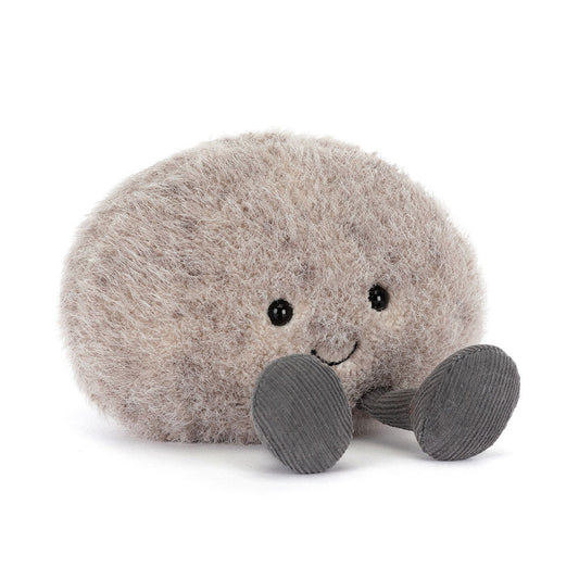 Jellycat Plush Amuseables Pebble Plush toy resembling a round pebble with a smiling face and grey feet on a white background