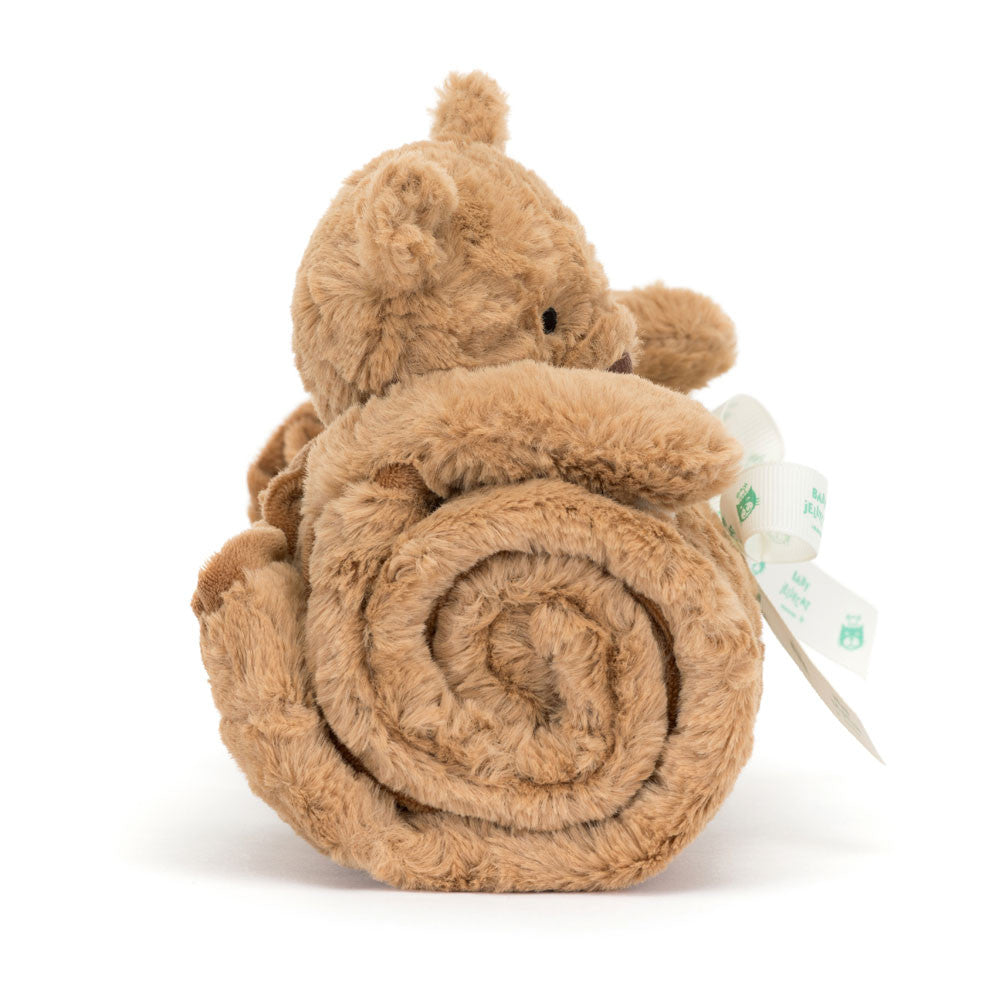 Side view of Jellycat Plush Bartholomew Bear Blankie Brown plush toy resembling a bear rolled up with a tag on a white background