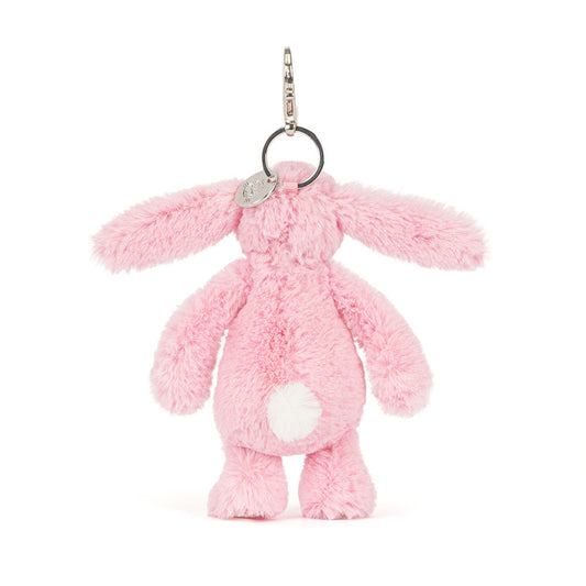 Back view of Jellycat Plush Blushkin Blossom Bunny Bag Charm with white fluffy tail against white background.