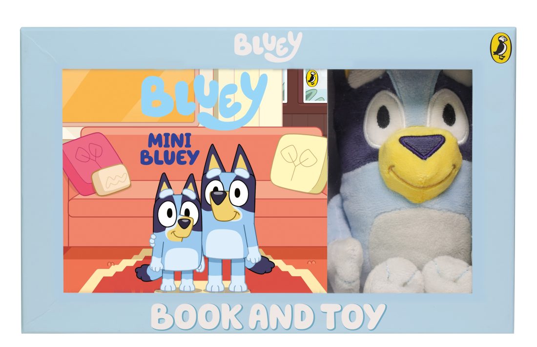 Packaging of 'Bluey' book and toy set with cartoon characters and blue background