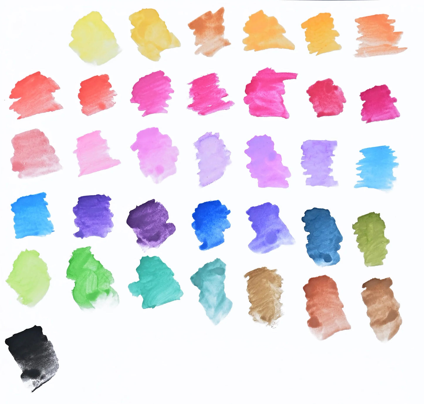 Collection of colorful watercolor swatches from Peter Pauper Press Studio Series Junior Watercolour Paint Set 36 Colours on a white background