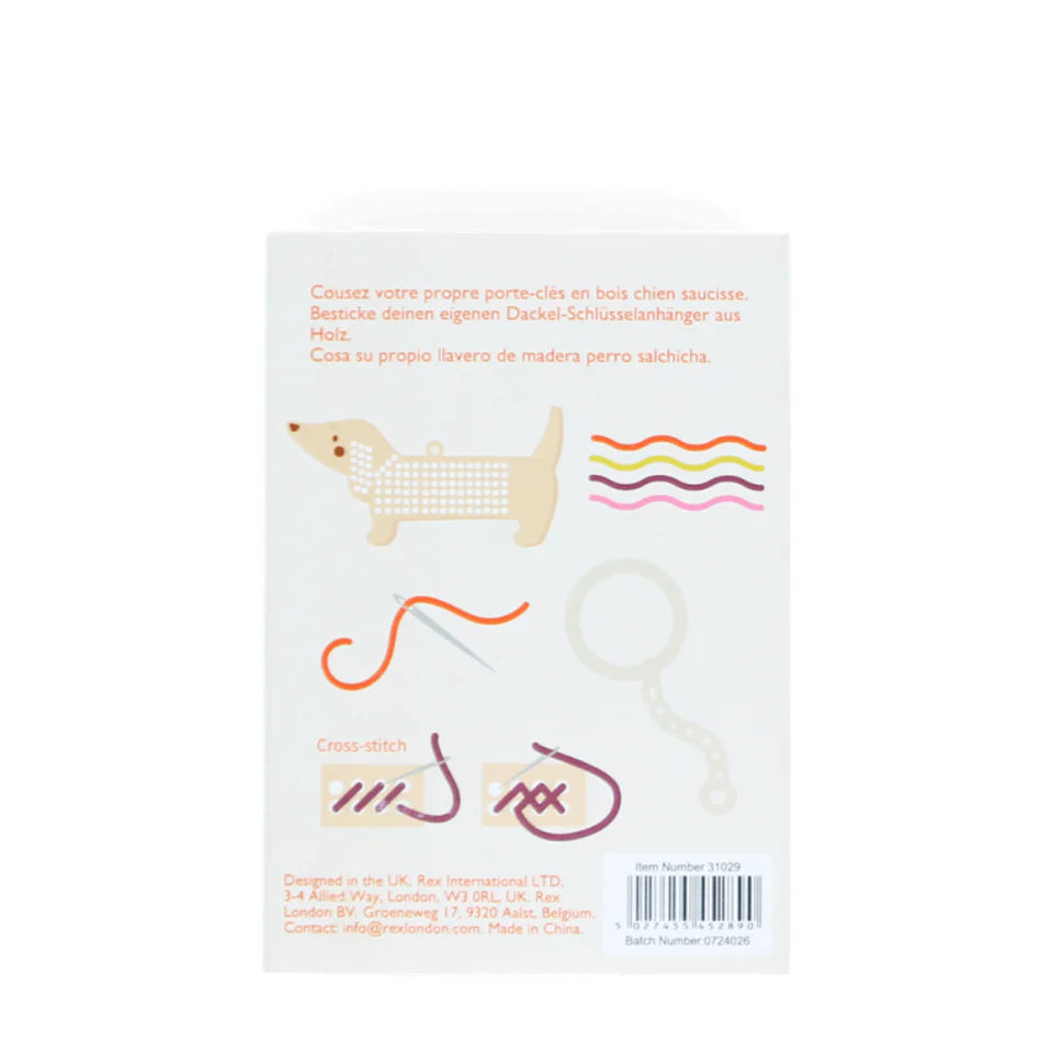 Product packaging for Rex London Stitch your own dog keyring with illustrations and text on a white background