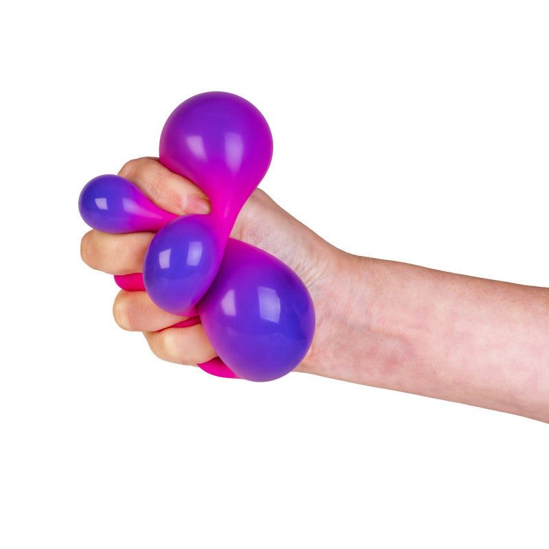Hand holding a Smooshos Colour Change Cube against a white background