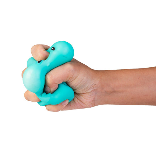 Hand holding a turquoise Smooshos crunchy pets against a white background