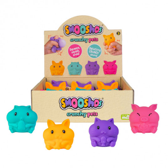 Display box of Smooshos crunchy pets with colorful animal-shaped toys on a white background