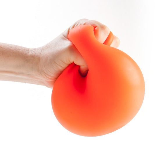 Hand holding an orange Jumbo Smooshos Neon stress ball against a white background