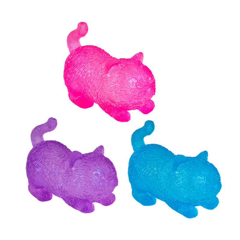 Three colorful Smooshos Super Squeeze Glow in the Dark Cat in pink, purple, and blue on a white background