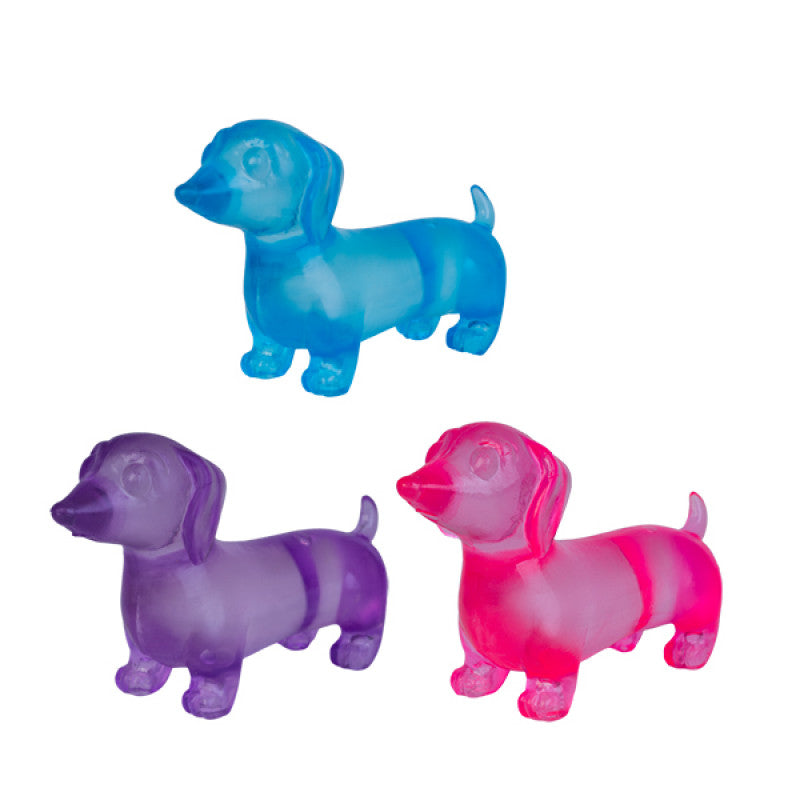 Three colorful Smooshos Super Squeeze Glow in the Dark Dachshunds on a white background