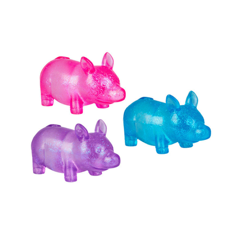 Three colorful Smooshos Super Squeeze Glow in the Dark Pig in pink, purple, and blue on a white background
