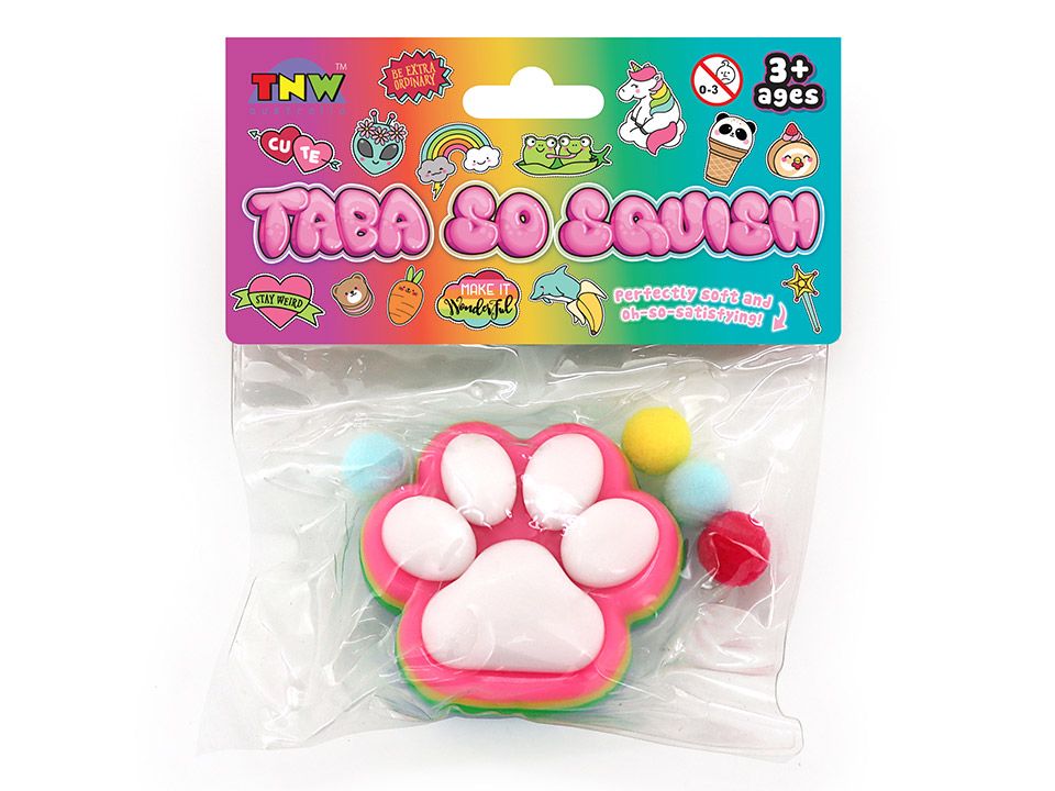 A packaged TNW Taba So Squish toy featuring a pink and white paw print with small colorful balls, sealed in a clear plastic bag with a colorful printed header card.