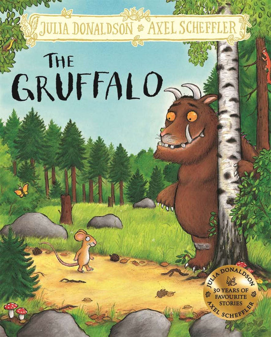 Hardback gift edition cover of The Gruffalo by Julia Donaldson & Axel Scheffler showing the mouse and the Gruffalo in the Deep Dark Wood – deluxe picture book for children aged 3-7.