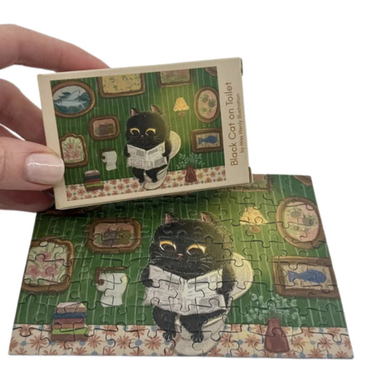 The Puzzle Collab 99pc Micro Jigsaw Puzzle Black Cat on the Toilet
