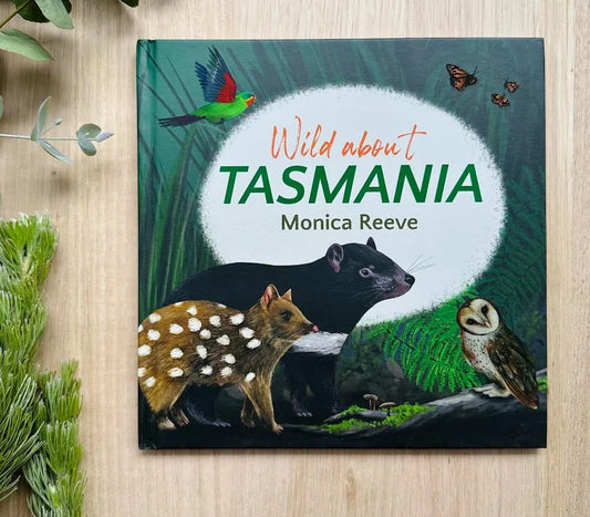 Book cover of Wild About Tasmania by Monica Reeve featuring a Tasmanian Devil, Quoll and Owl