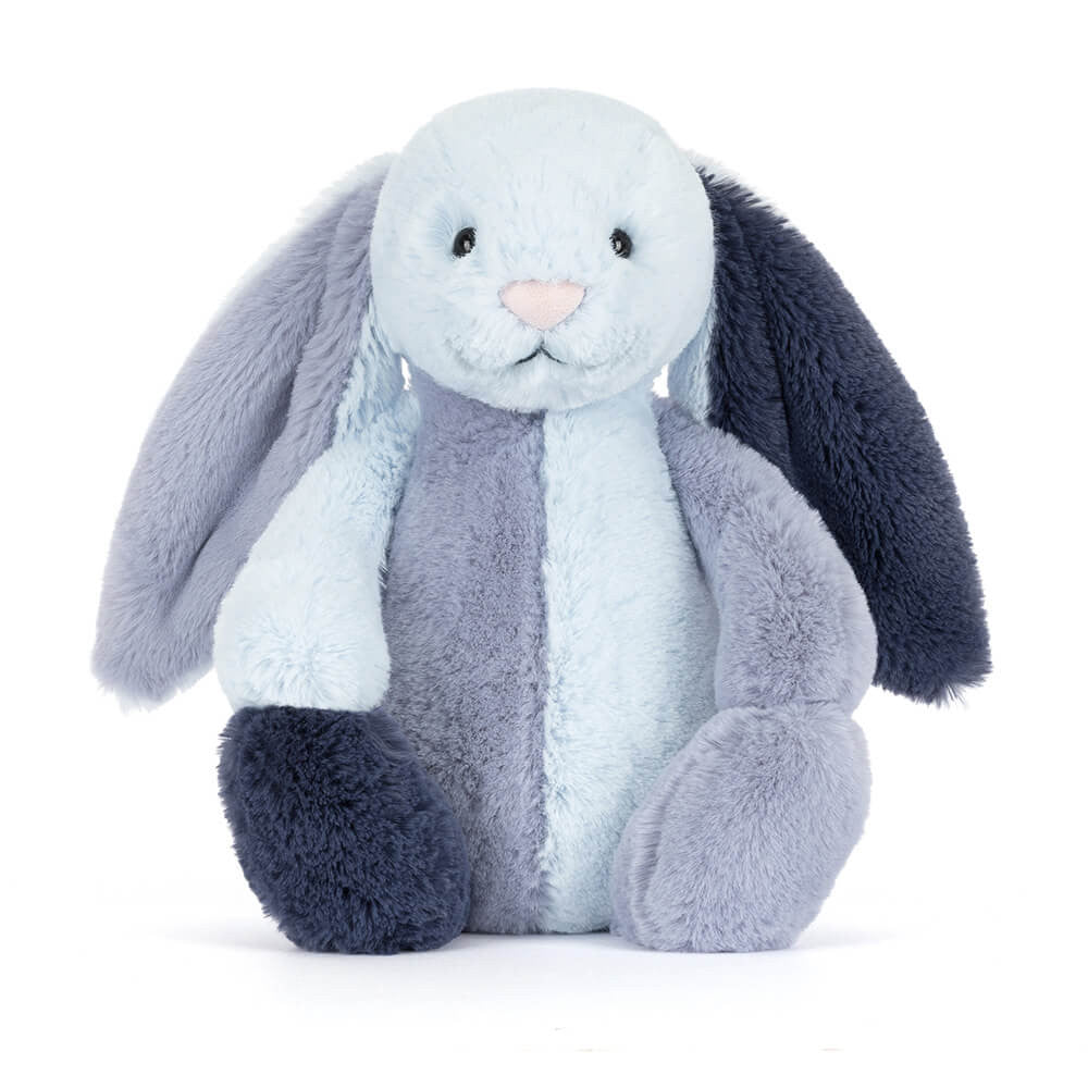 Geometric light and dark blue bunny toy against a white background