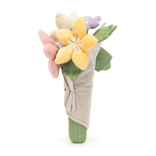 Jellycat Amuseables Bouquet of Flowers plush toy from Plato’s, shown from the side, featuring soft pastel blooms in a smiling fabric wrap.