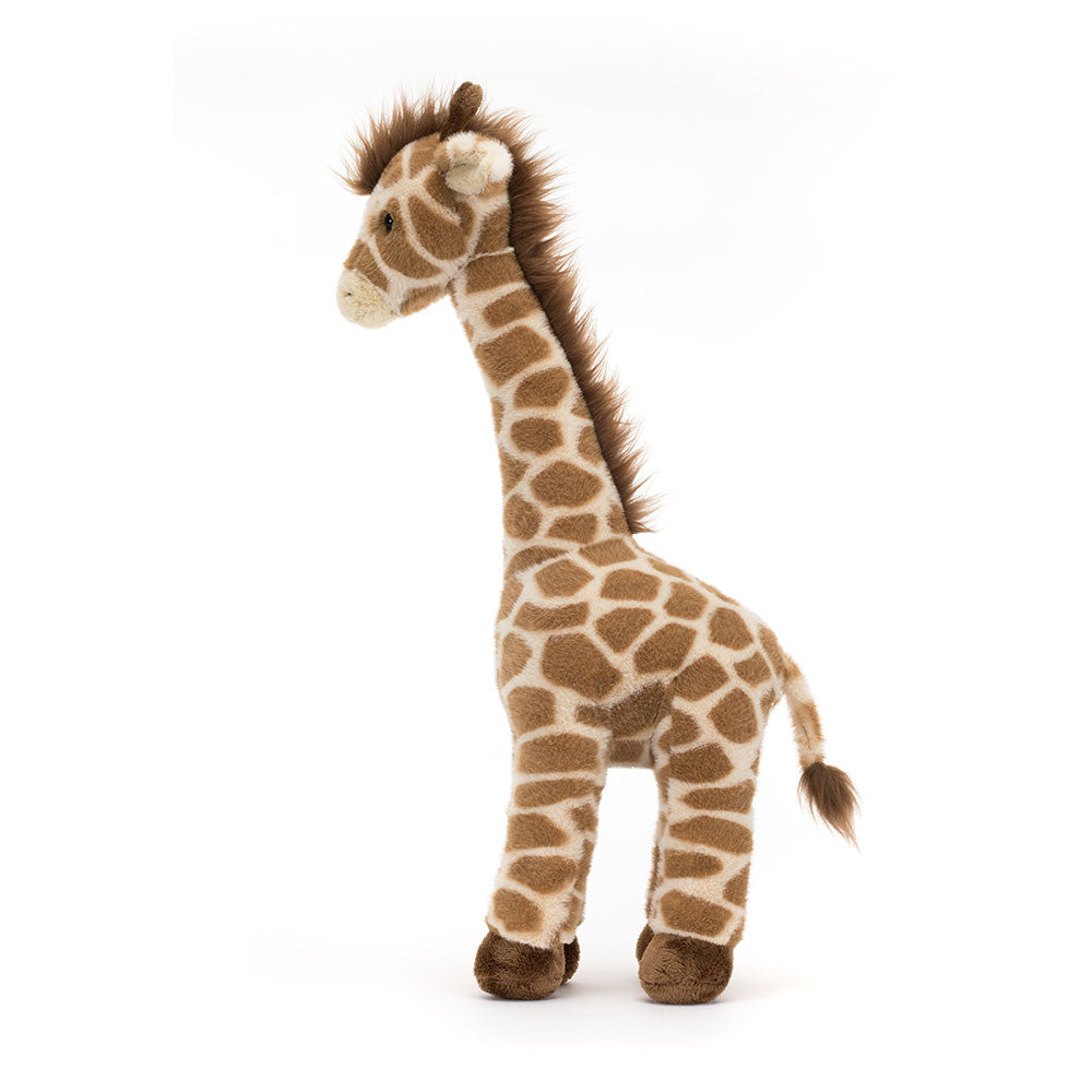 Jellycat Dara Giraffe plush toy from Plato’s, shown from the side, featuring soft patterned fur, long legs, and a sweet smiling face.