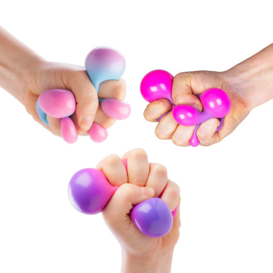 Three hands squeezing pink and purple Smooshos Colour Change Ball stress balls against a white background