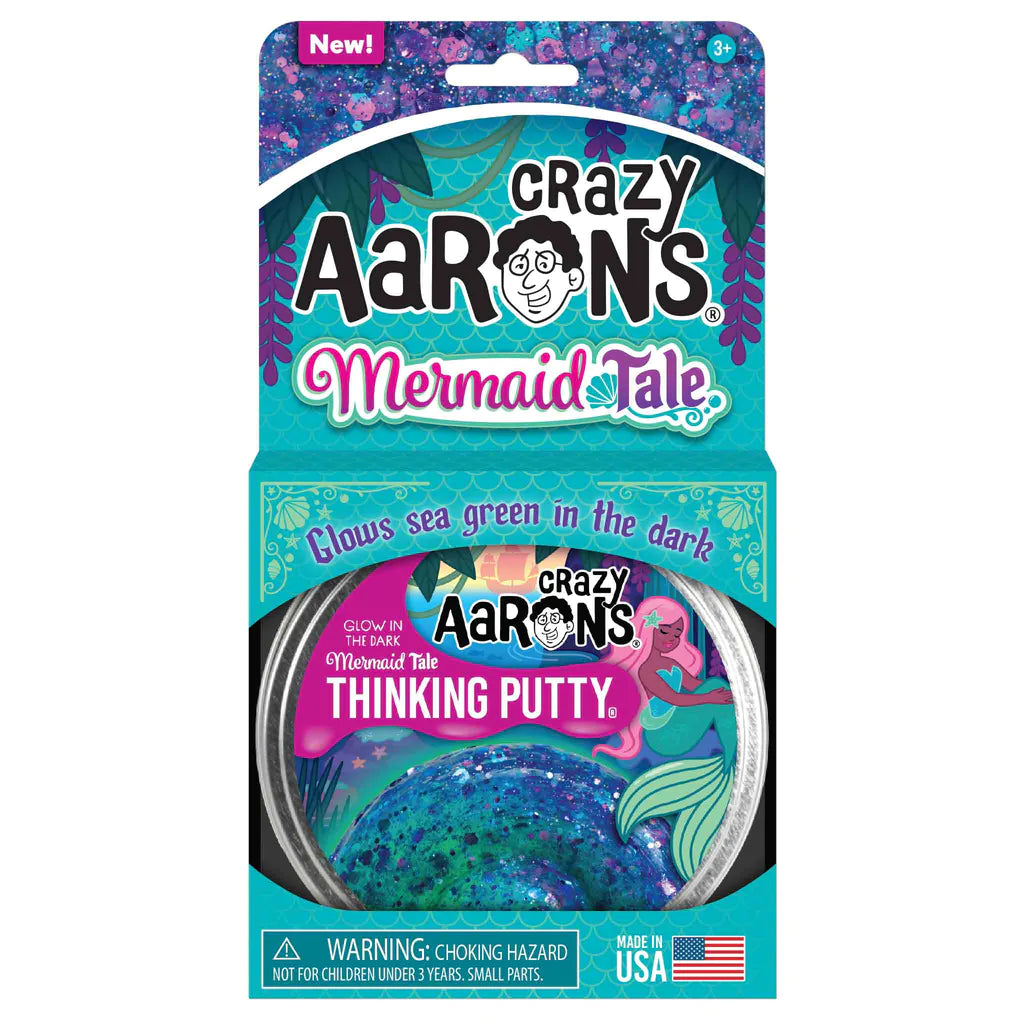 Packaging of Crazy Aarons Trendsetters Thinking Putty in Mermaid Tale color, featuring a tin of putty and sea green glowing properties.